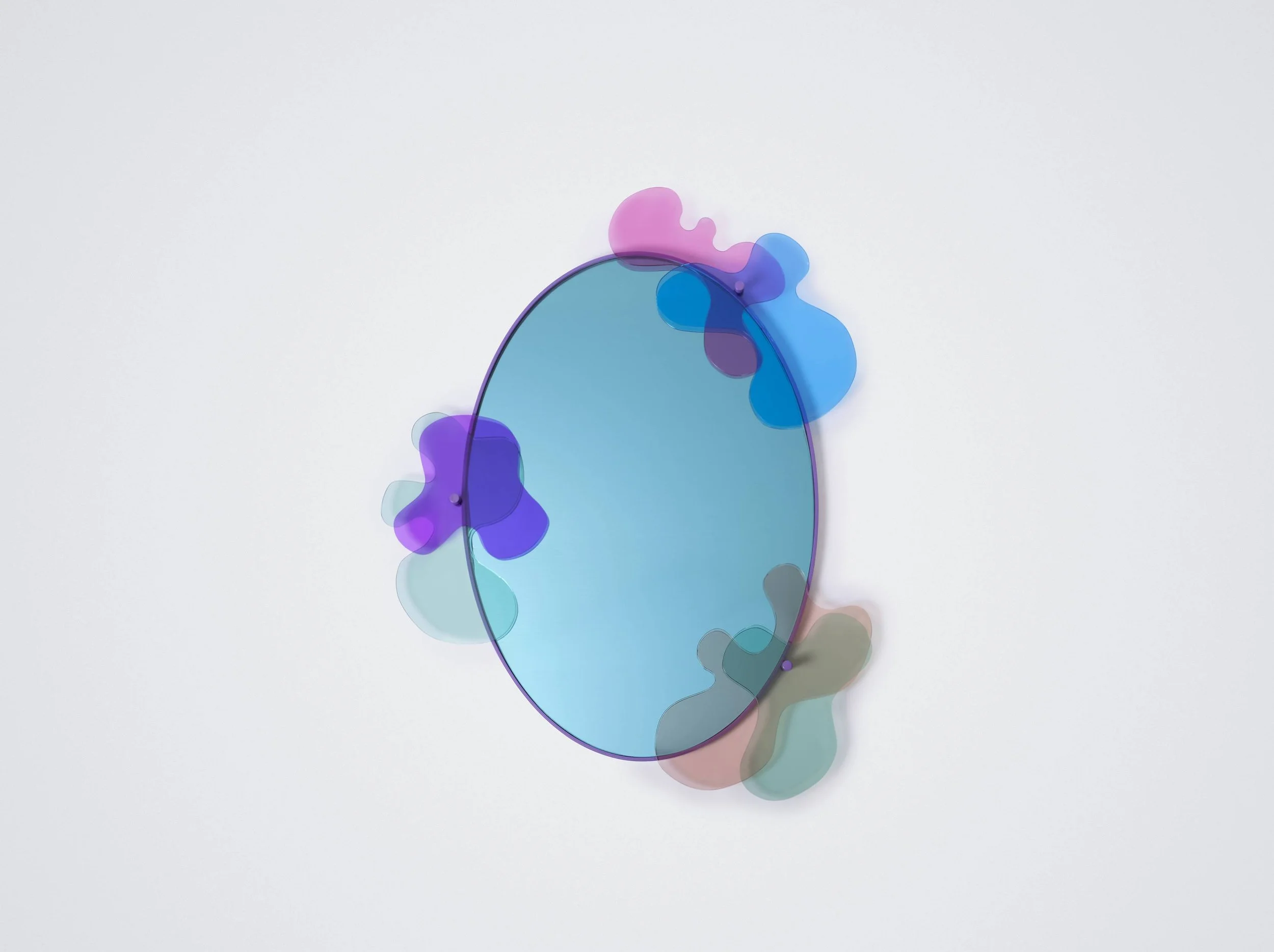 Abstract wall art featuring an oval mirror with colorful, irregularly shaped overlays in shades of purple, pink, blue, gray, and green on a plain white background.