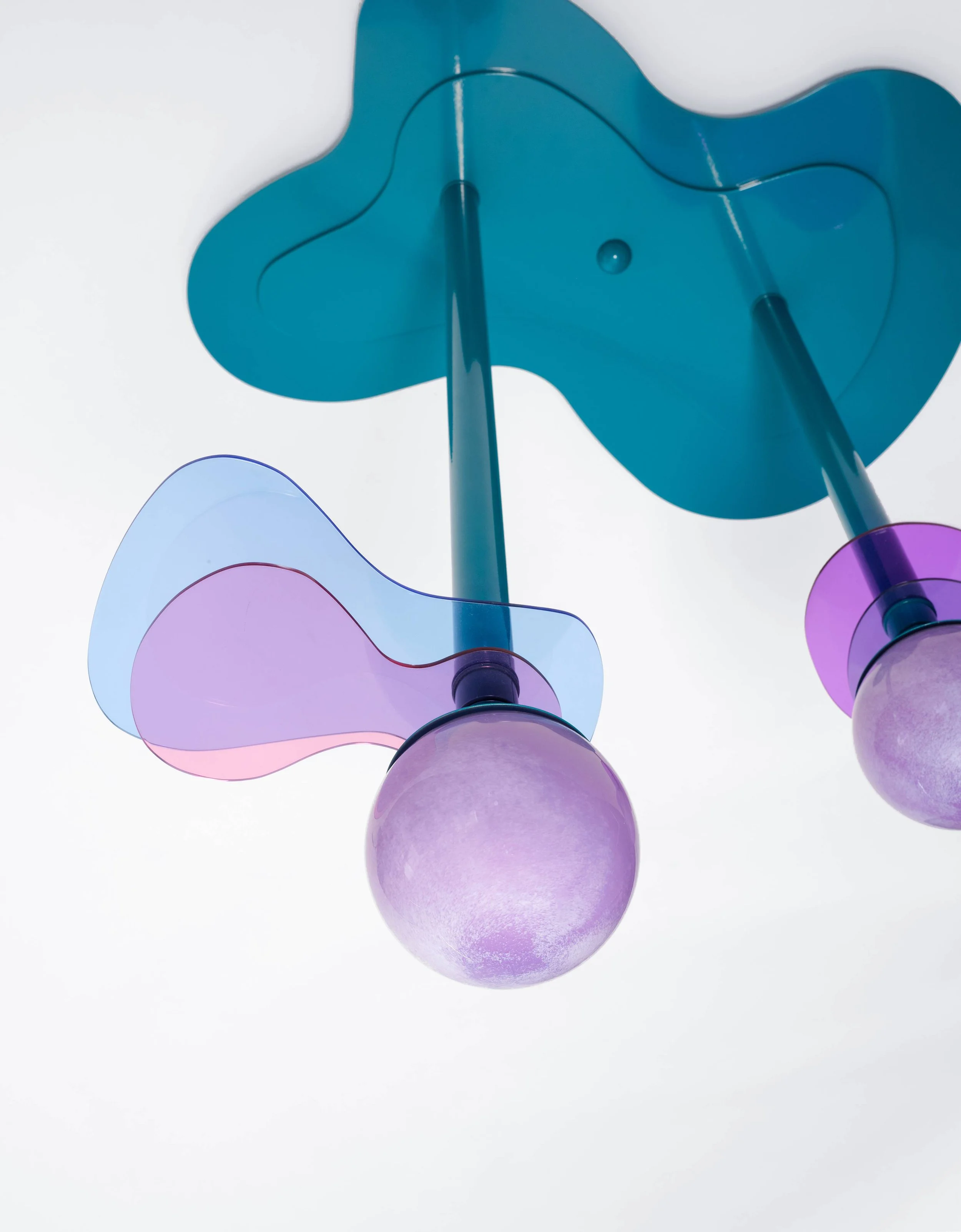 Colorful modern ceiling light fixture with blue and purple accents and spherical bulbs.