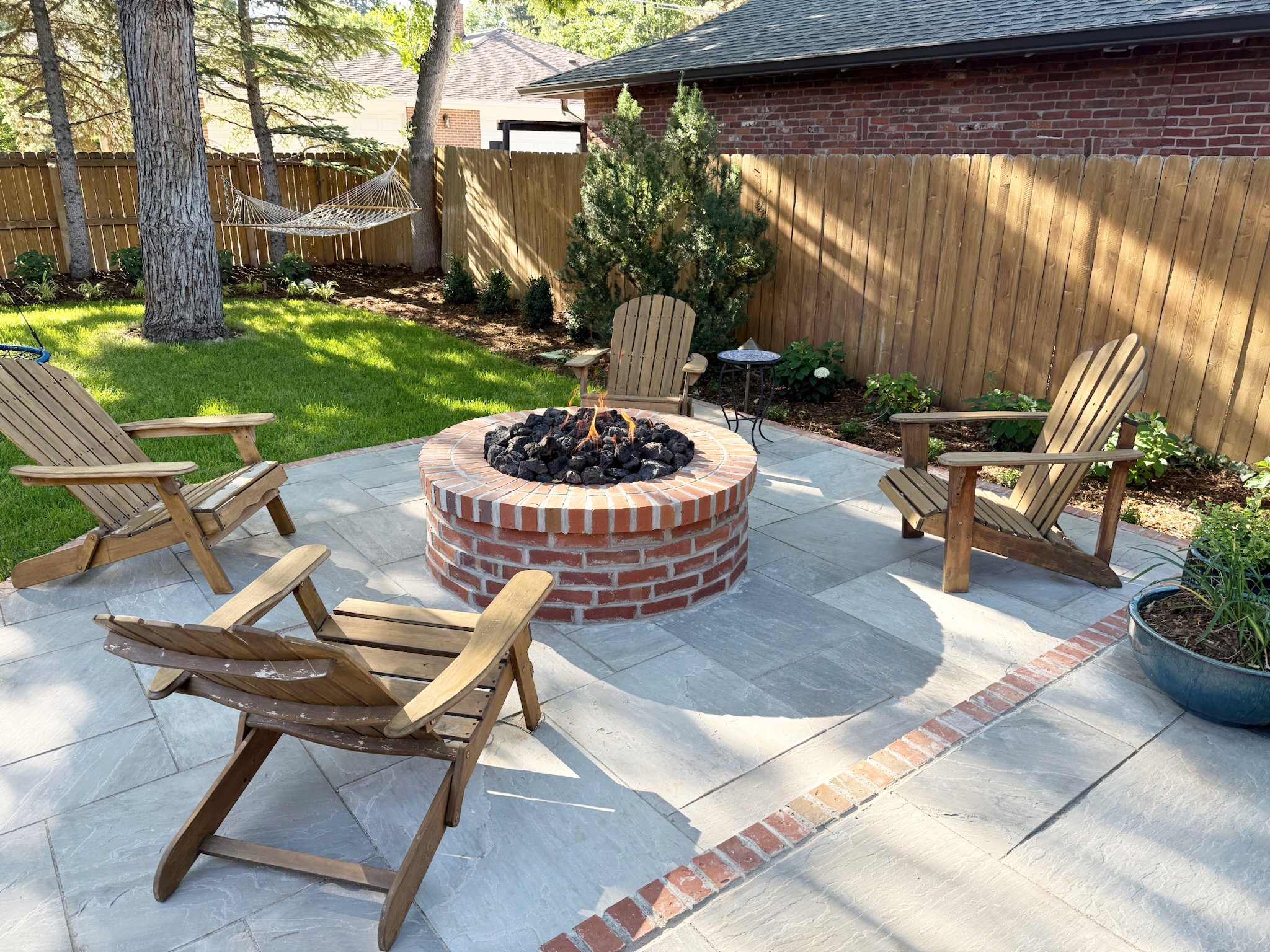 cozy firepit and backyard remodel in Denver Colorado by Aquila Landscapes Design & Build