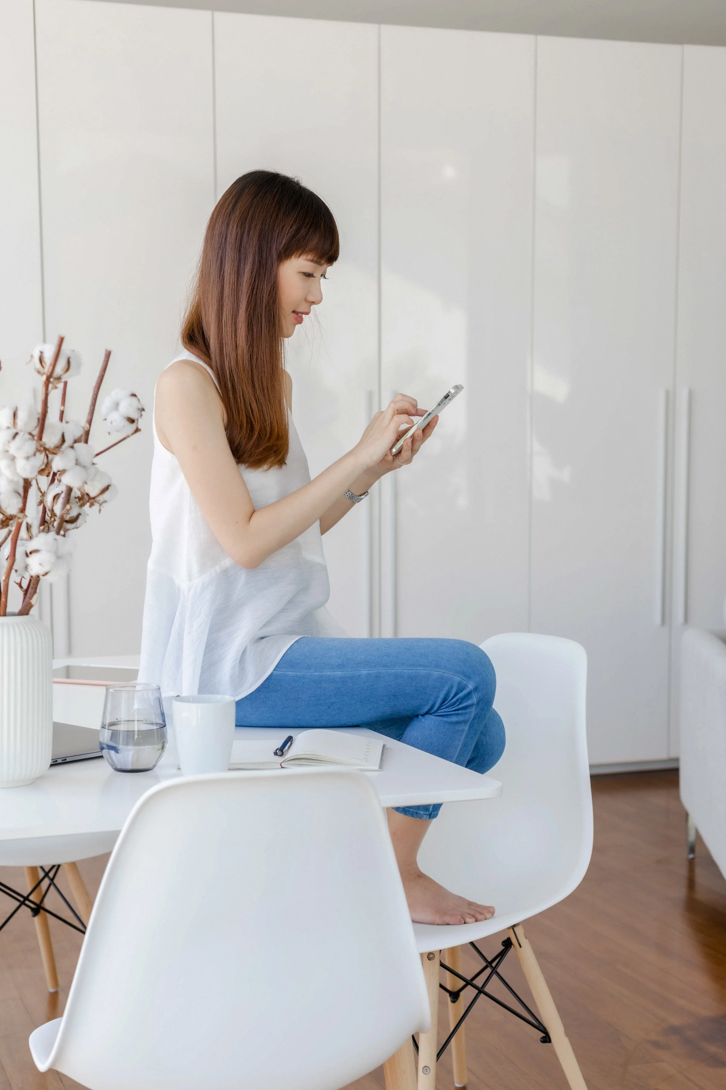 Woman multitasking at home, symbolizing high-functioning stress and emotional overload.