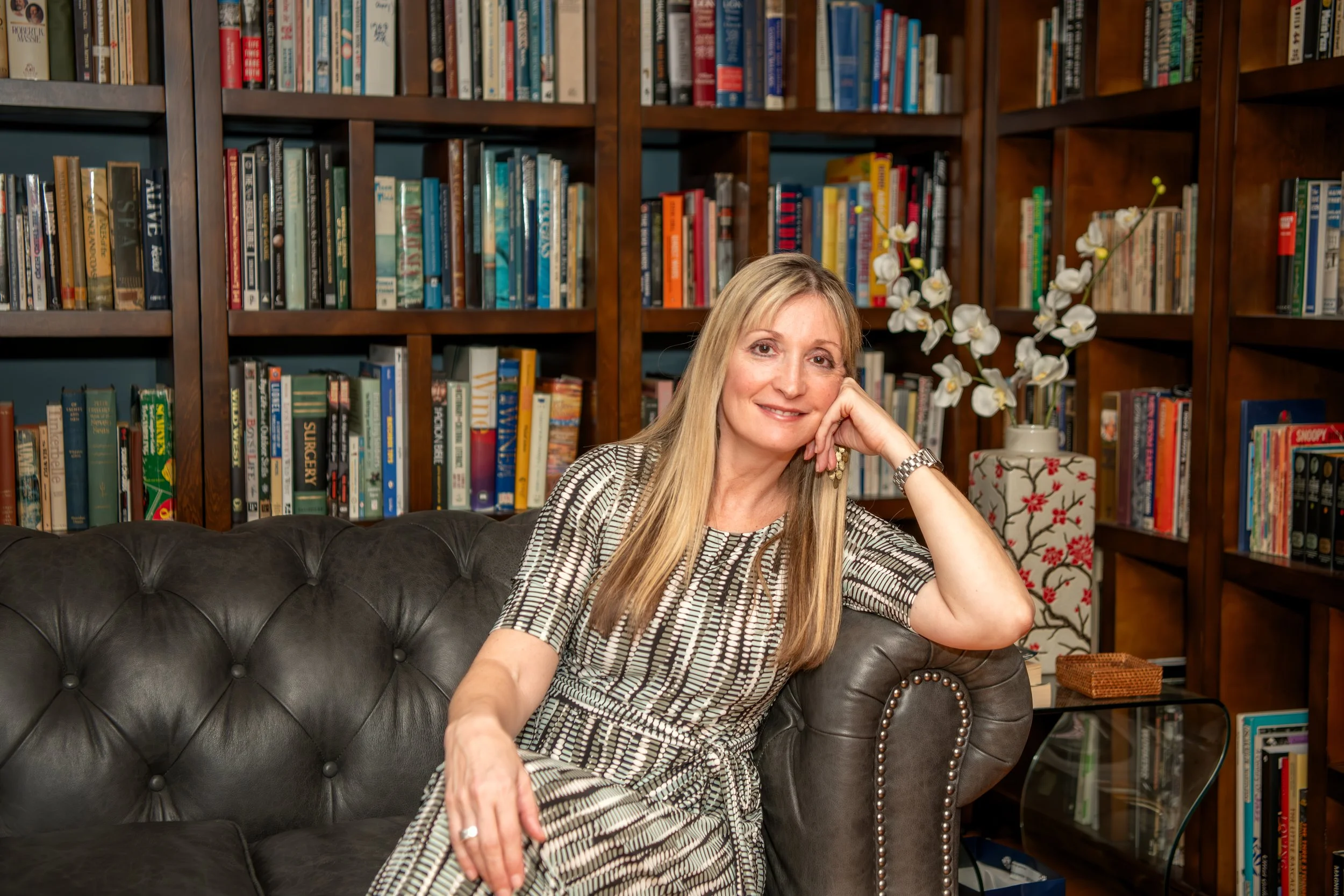 Dr. Trish Schneider in her clinical office, specializing in functional psychiatry and root-cause lab analysis for women.