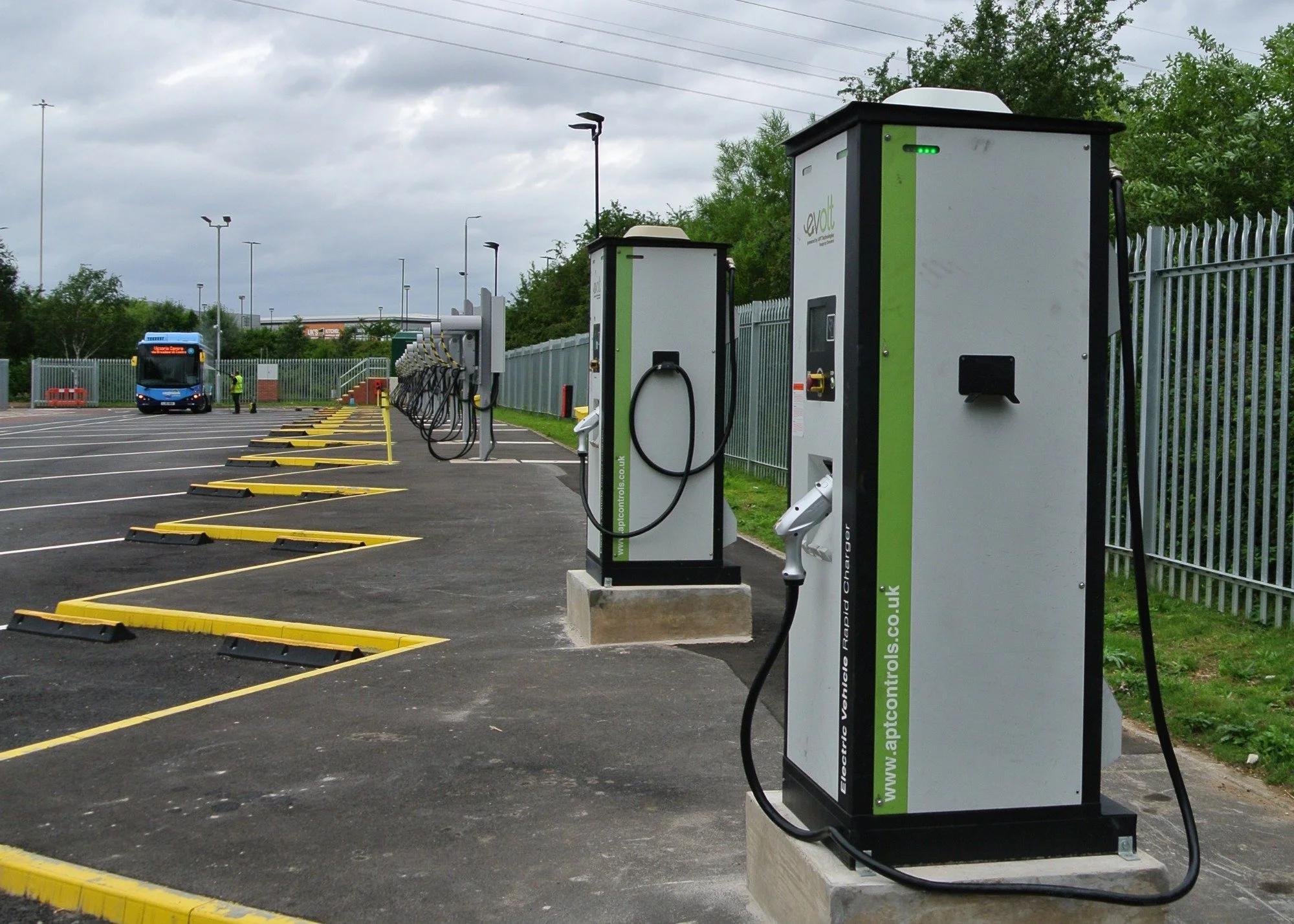Electric vehicle charging stations in a car park.