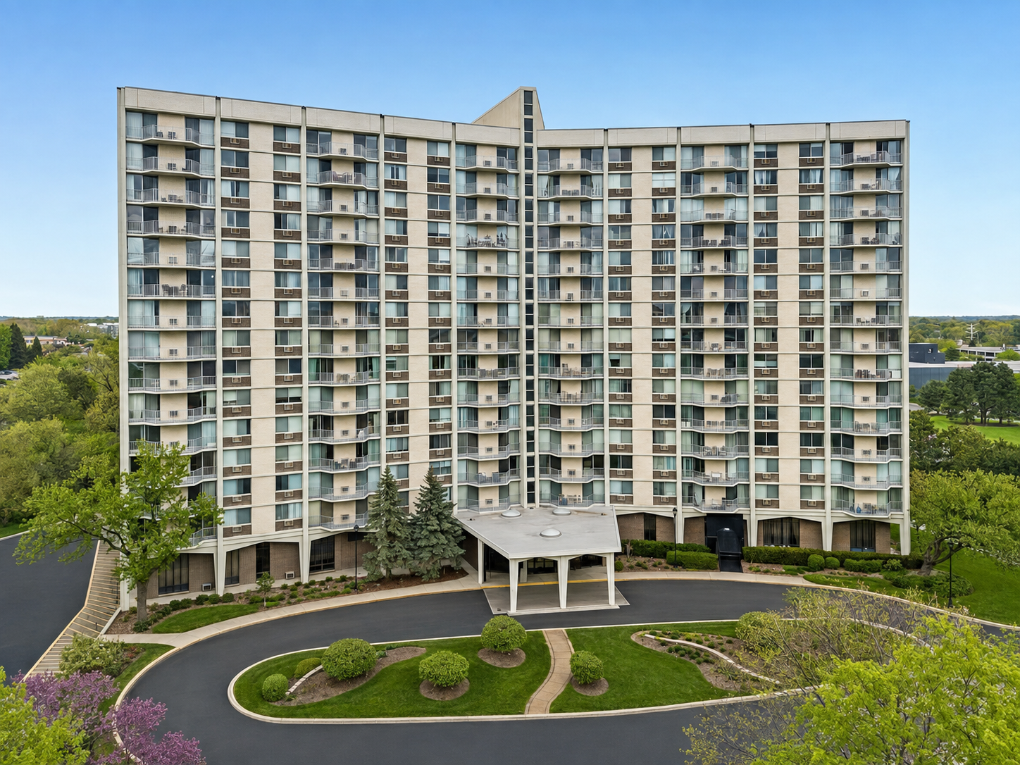 High-rise residential building and landscaped entrance in Oakbrook Terrace, Illinois