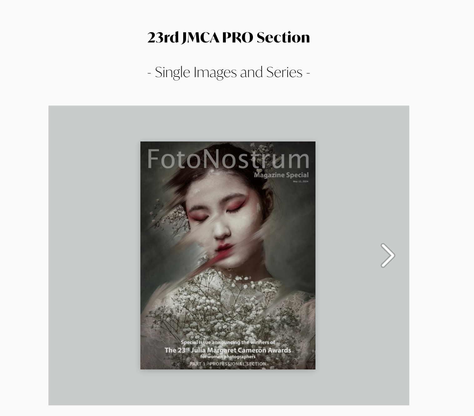 Magazine cover featuring a woman with closed eyes, wearing makeup, surrounded by branches and white flowers, with a blurred background.