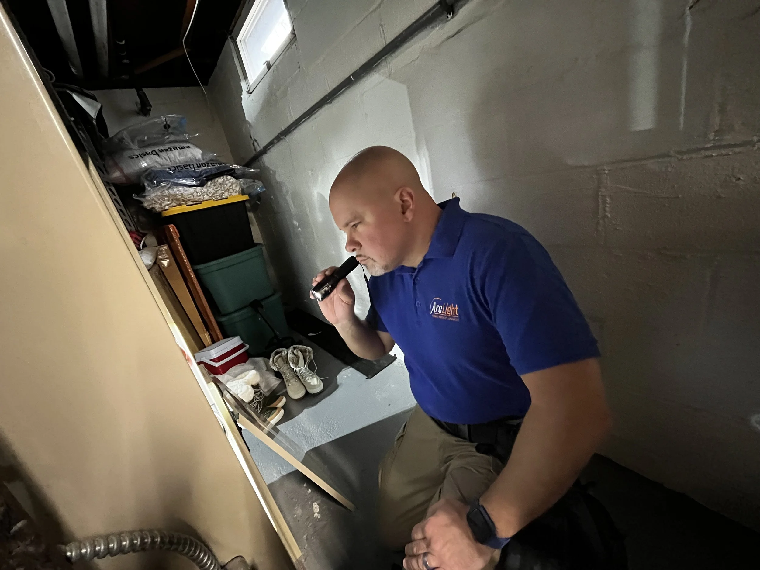 James Morales from Arc light home inspections performing a residential home inspection basement HVAC furnace