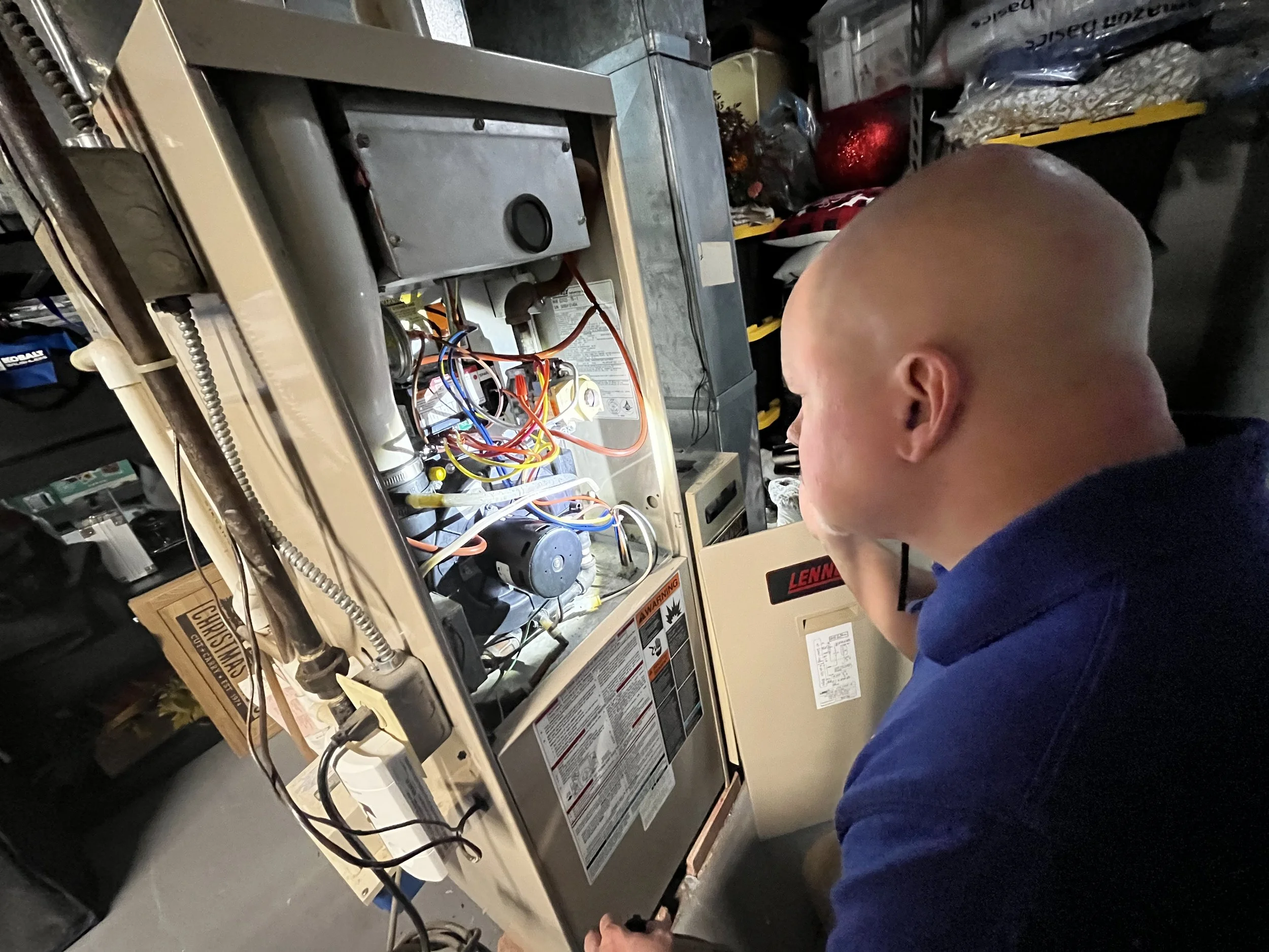 James Morales from Arc light home inspections performing a residential home inspection HVAC furnace inspection