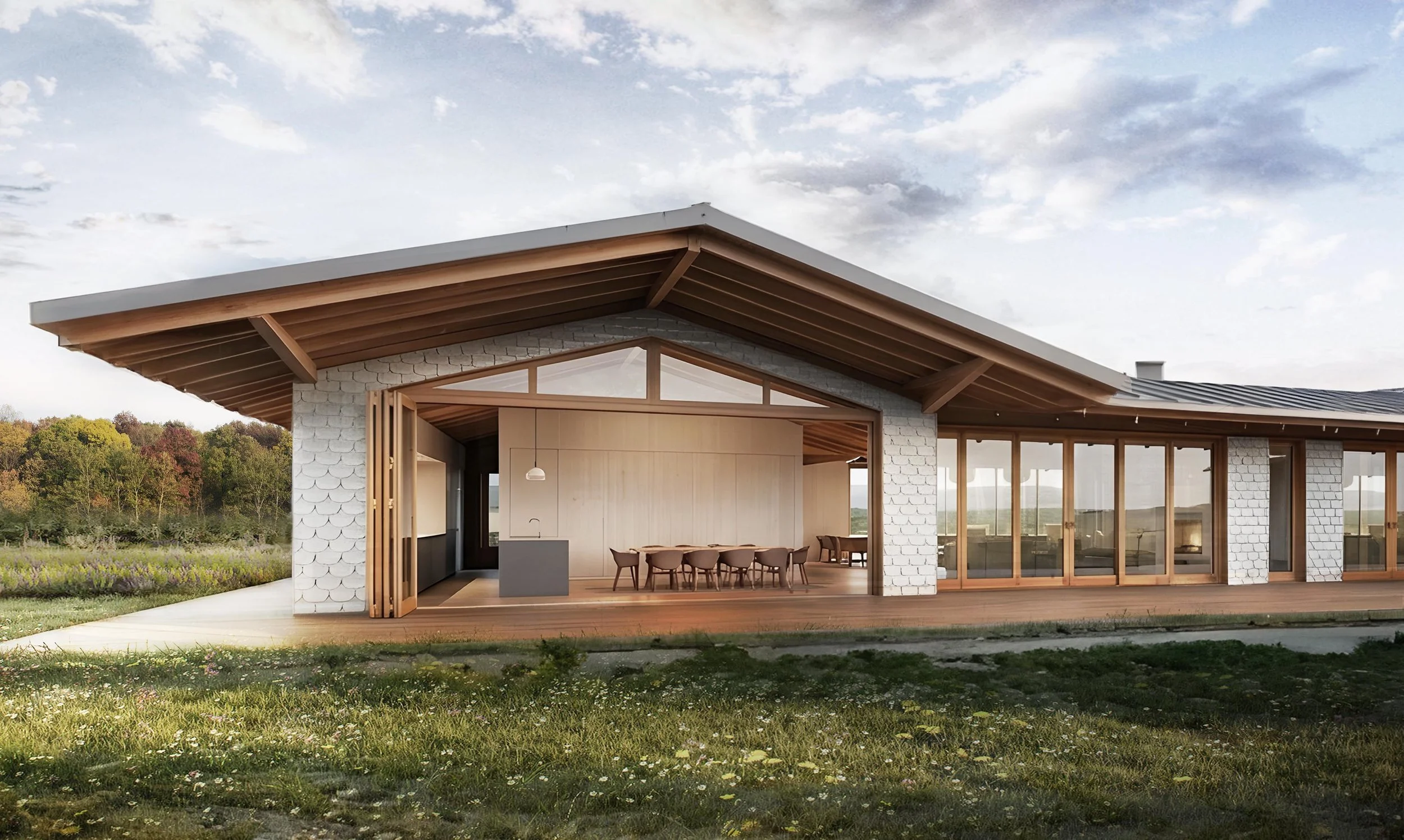 Modern house with large glass windows, wooden roof, and outdoor patio, surrounded by grassy landscape and trees.