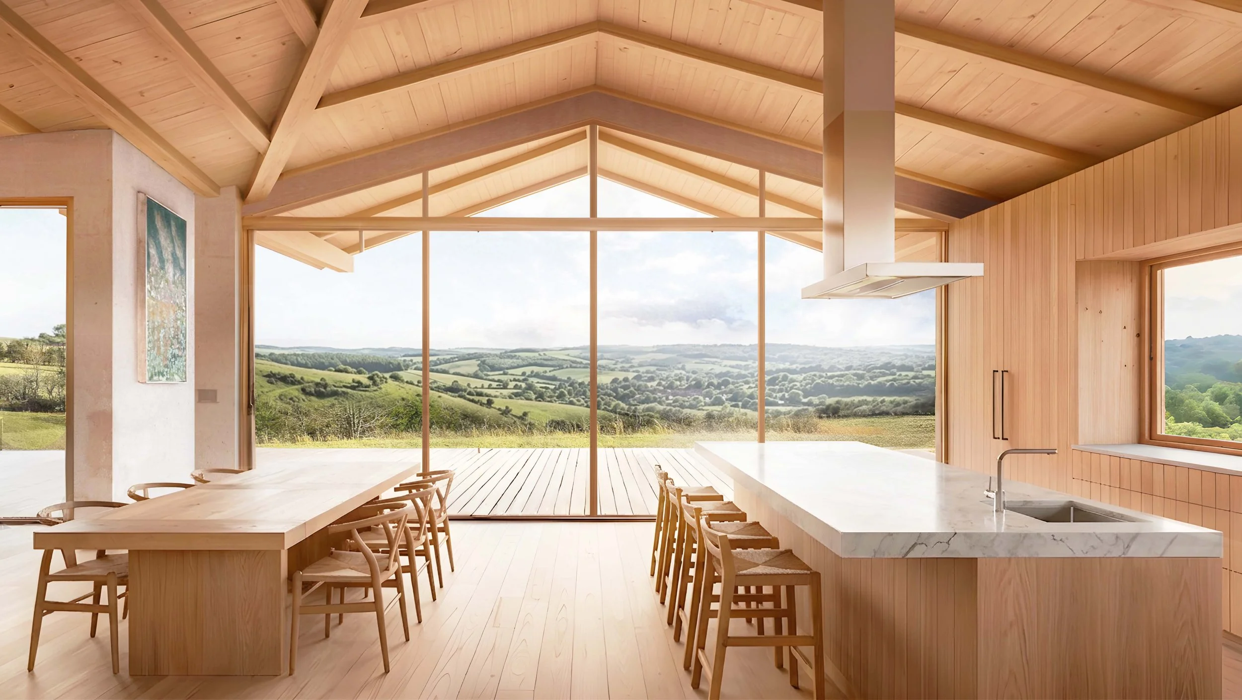 Interior view of a modern kitchen and dining area with large floor-to-ceiling windows showing a scenic landscape of rolling hills and greenery.