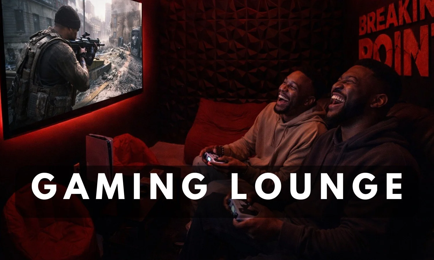 Friends laughing and playing video games on a large screen in the immersive gaming lounge Breaking Point Rage Room