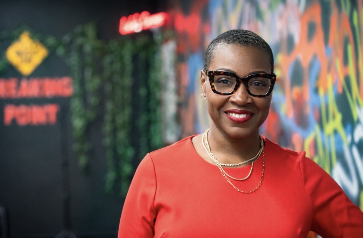 Melody Billups, owner of Breaking Point Rage Room stands inside her facility for a photoshoot.