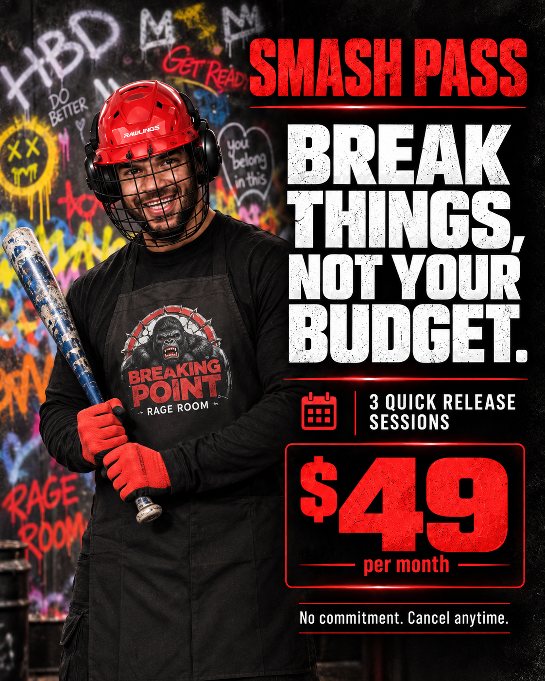 A man standing with a bat and wearing a red safety helmet and black tshirt with the breaking point logo