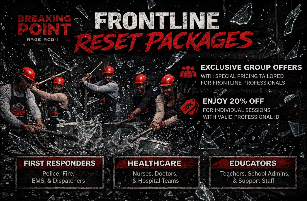 A group of people in safety gear smashing on a flyer for Frontline reset packages at Breaking Point Rage Room