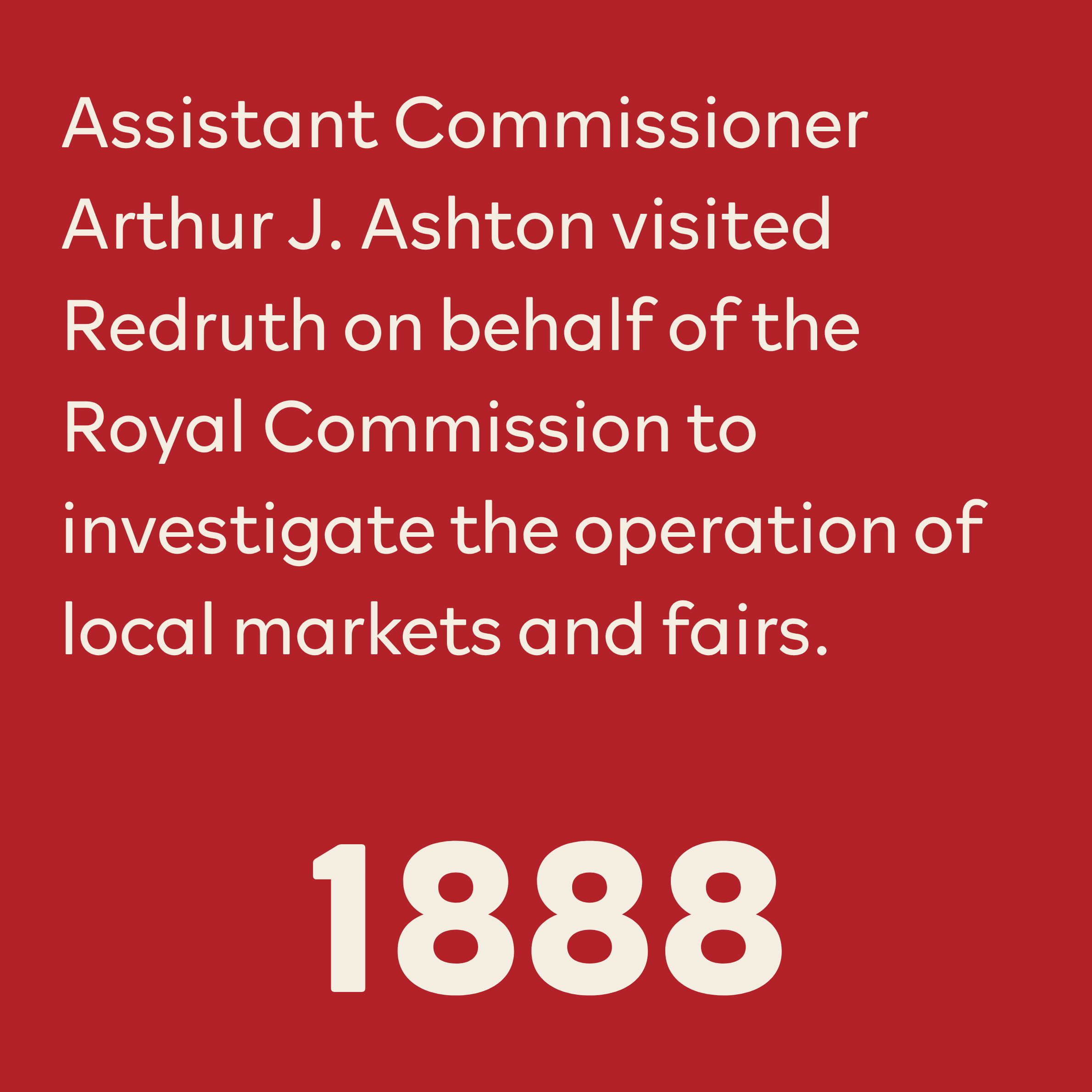 Sign with white text on a red background stating 'Assistant Commissioner Arthur J. Aston visited Redruth on behalf of the Royal Commission to investigate the operation of local markets and fairs.'