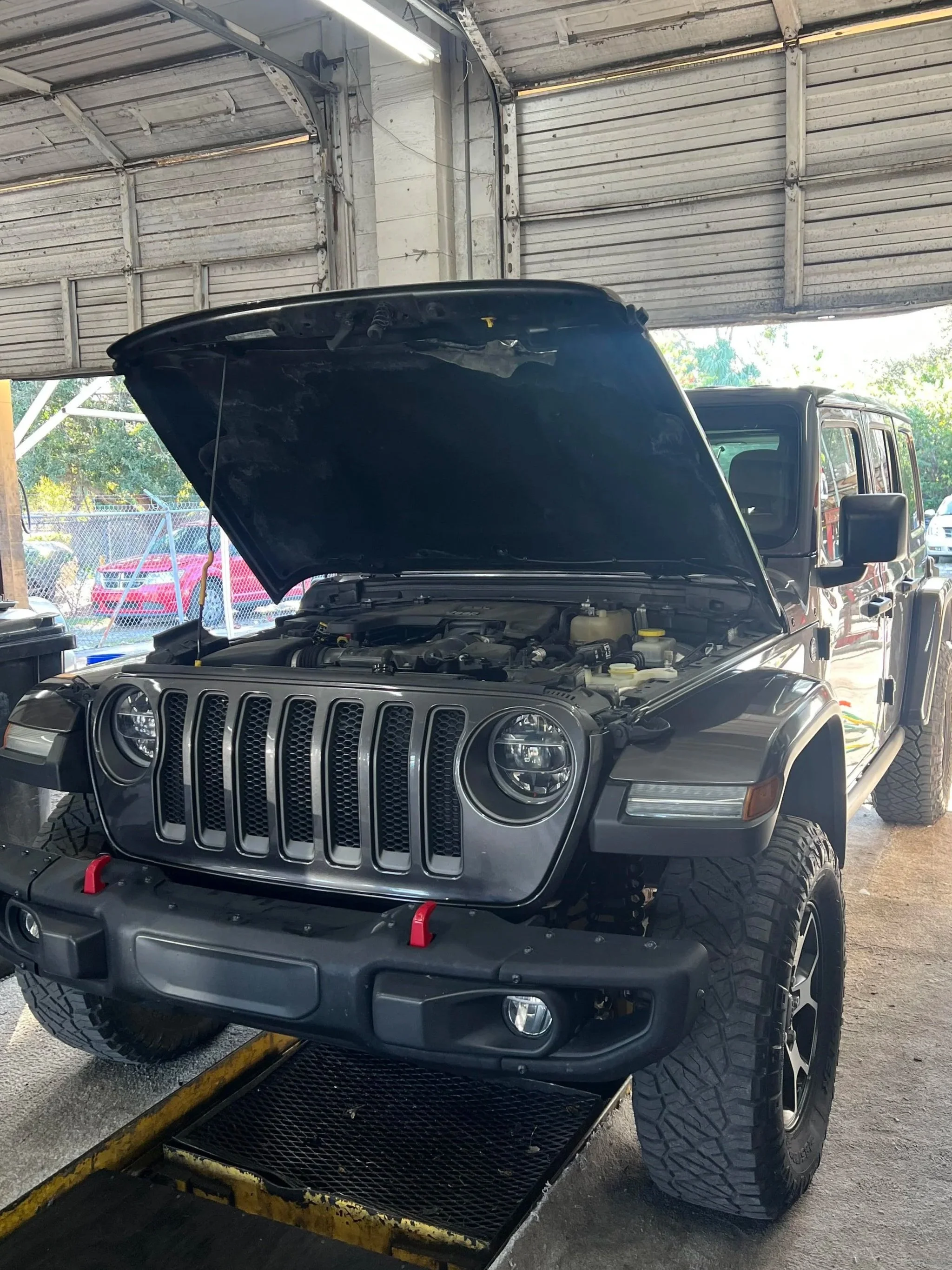 a 2020 Jeep Wrangler undergoing an oil change service
