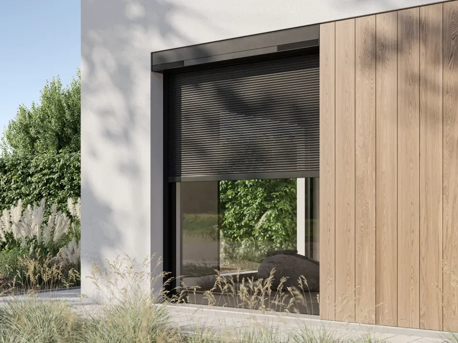 Modern house exterior with large window, black roller shutter, wooden panel siding, and surrounding greenery.