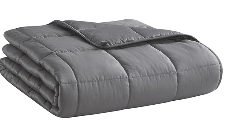 Gray quilted sleeping bag with a matching pillow, partially unzipped