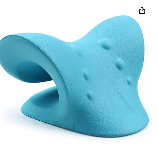A light blue fish-shaped foam chair or stool with textured surface and small circular indentations.