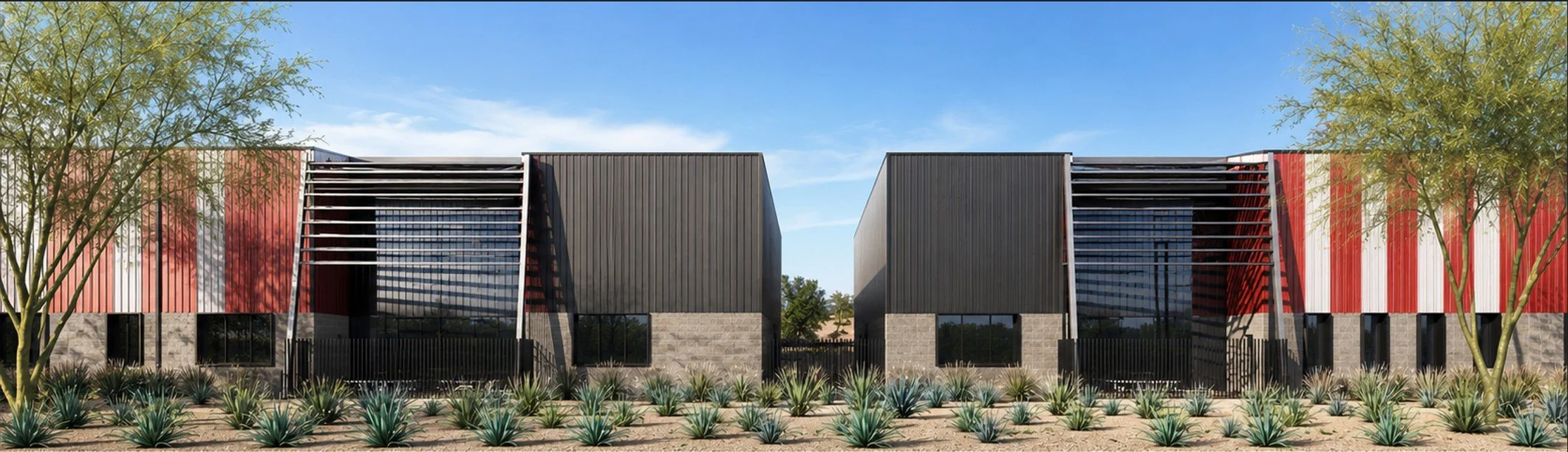 Modern two-story building with black panels, red and white vertical striped accents, and large glass windows, flanked by desert plants and trees under a blue sky.