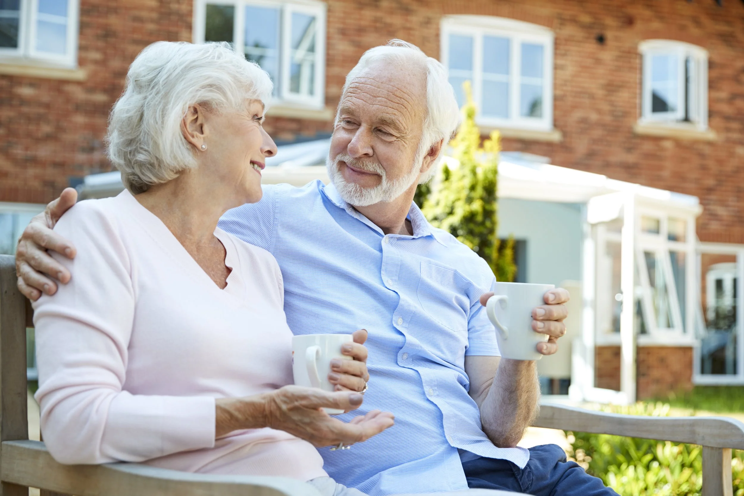 Elderly Couple enjoying house garden