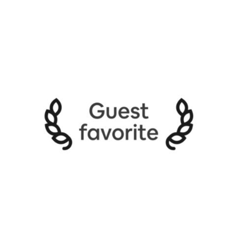 Black background with text that reads 'Guest favorite' surrounded by decorative laurel branches.