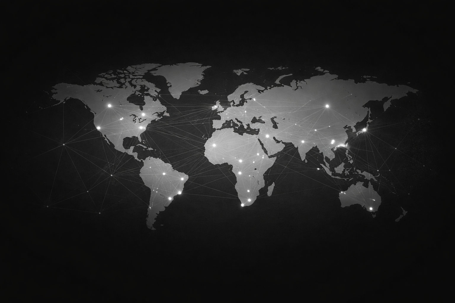 A black and white digital map of the world with illuminated dots and connecting lines representing global communication or network connections.