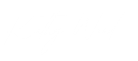 Stylized signature of Kathy Wood on a black background.