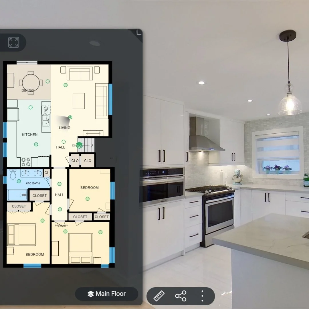 Floor plan of a house's main floor with rooms labeled, overlaid on a modern kitchen with white cabinets, stainless steel appliances, and a window with blinds.
