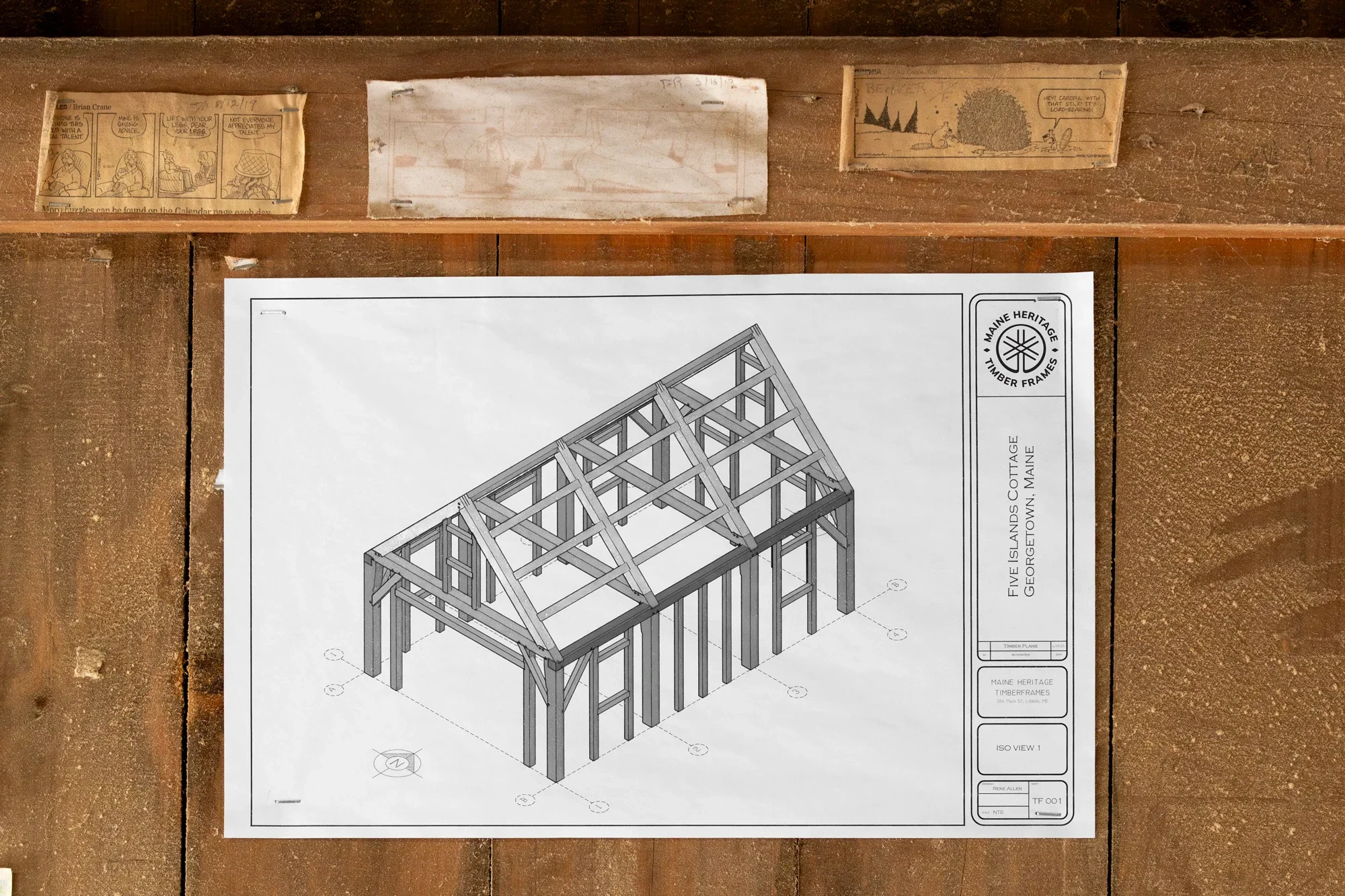 Blueprint drawing of a timber frame structure labeled 'Five Islands Cottage' from Maine Heritage Timber Frames, showing an isometric view of the building's wooden framing.