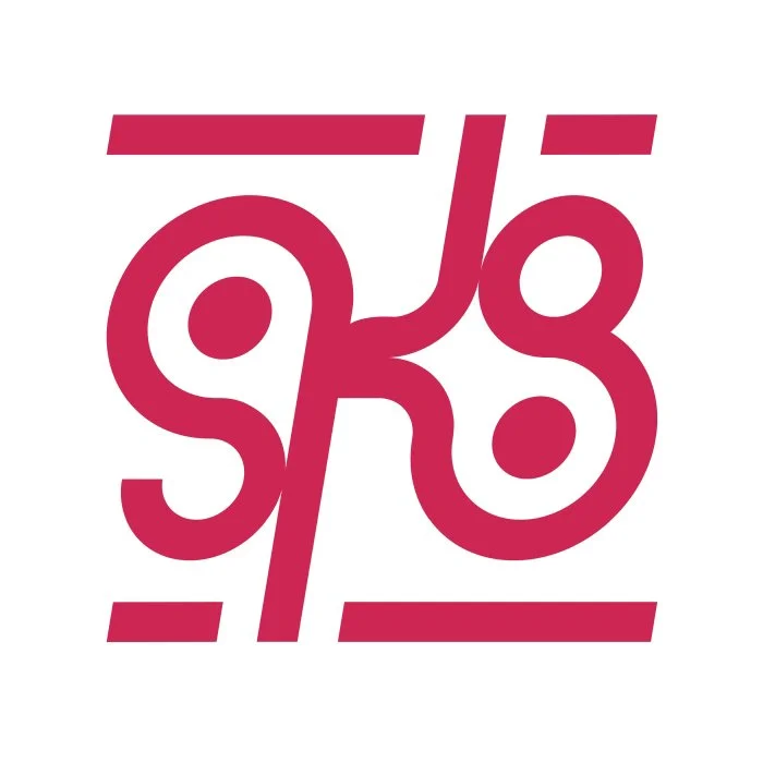 Stylized Hindi or Sanskrit script in maroon color on a white background.