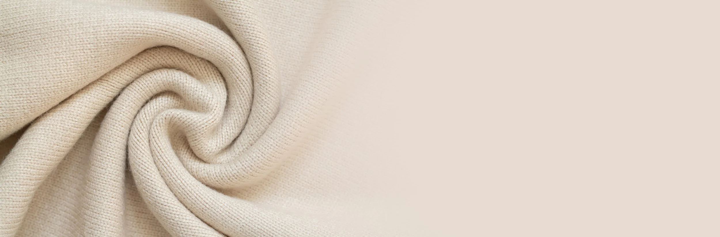 Close-up of beige fabric in a swirl pattern