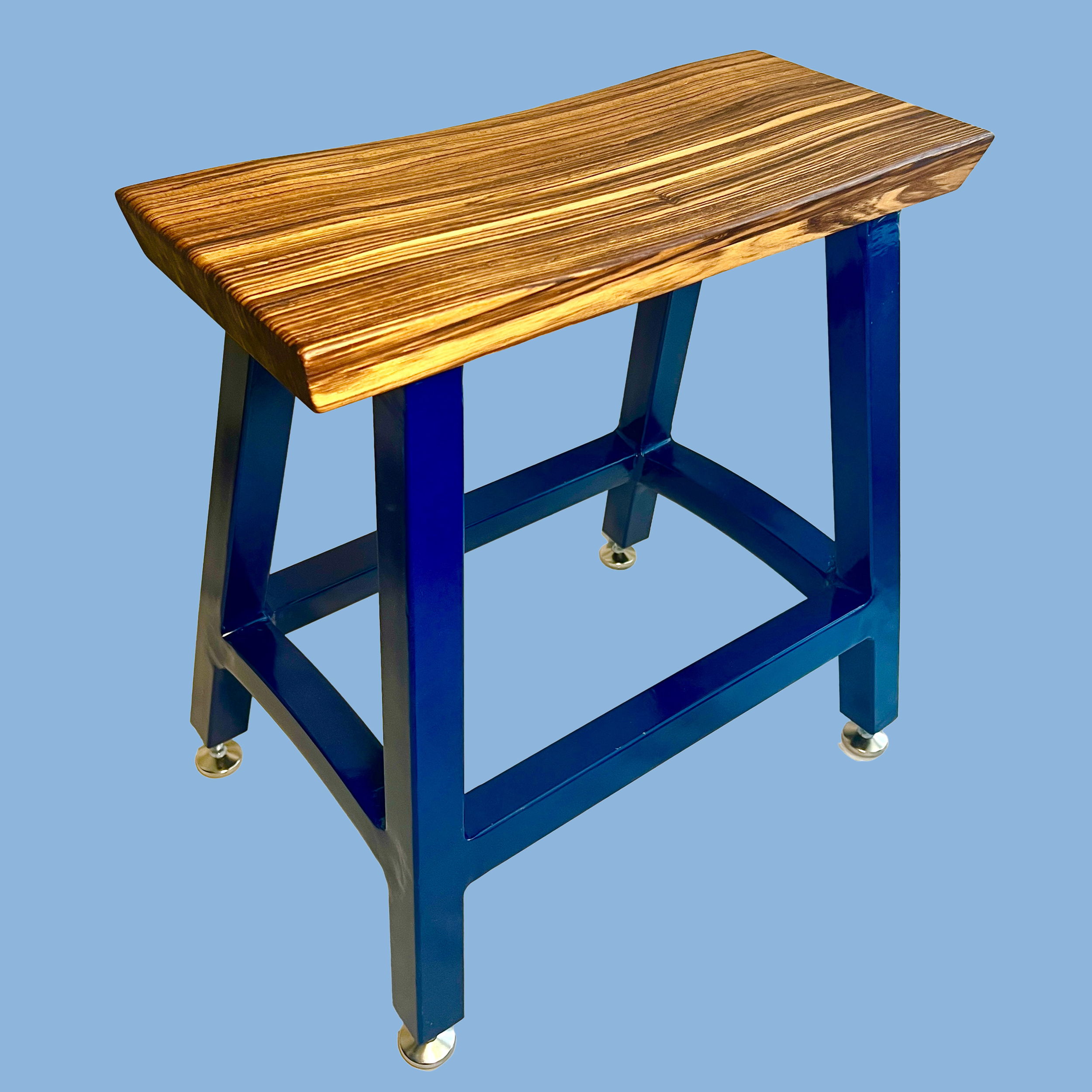 Stribet: A Welded Stool with a Carved Seat