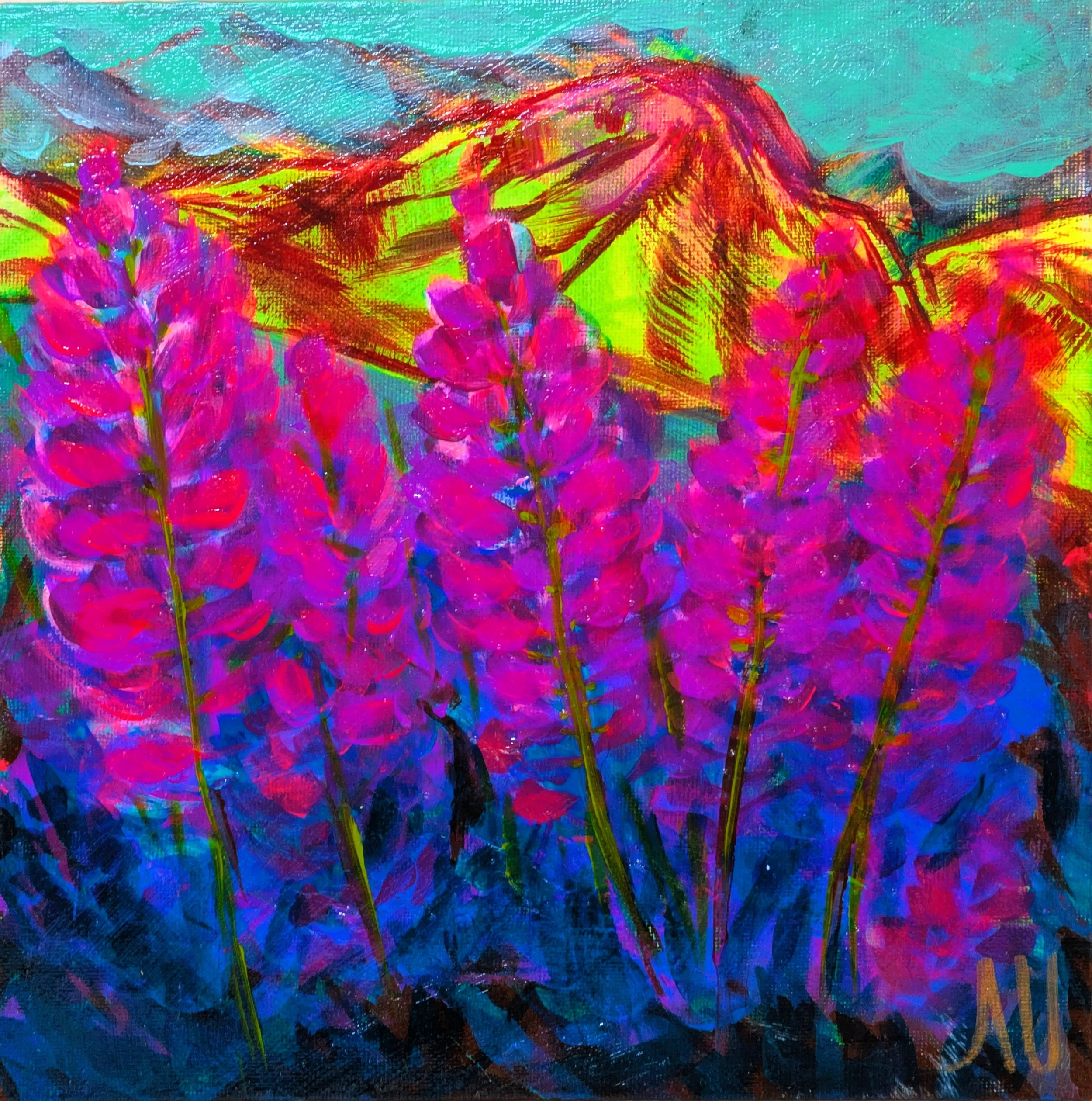 Purple fireweed blooms with Pioneer Peak and the Chugach Mountain Range in the background