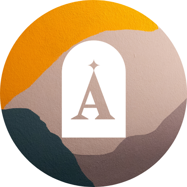 Stylized illustration with a circular background featuring abstract mountain shapes in orange, beige, and dark green. A white archway in the center contains an Eiffel Tower graphic with a star on top.