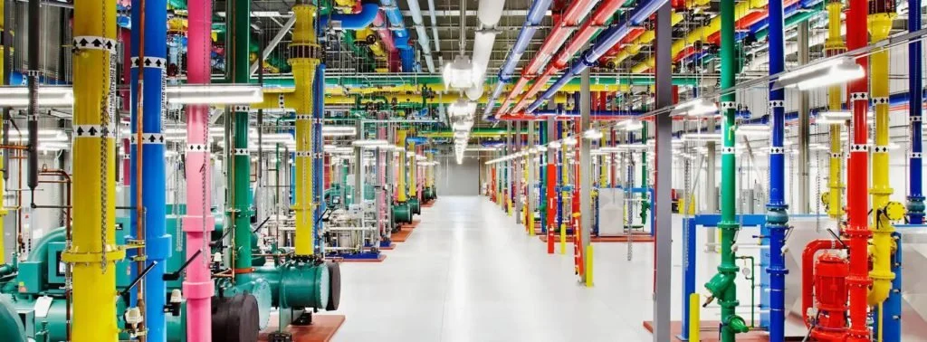 Industrial piping system with colored pipes and valves in a factory
