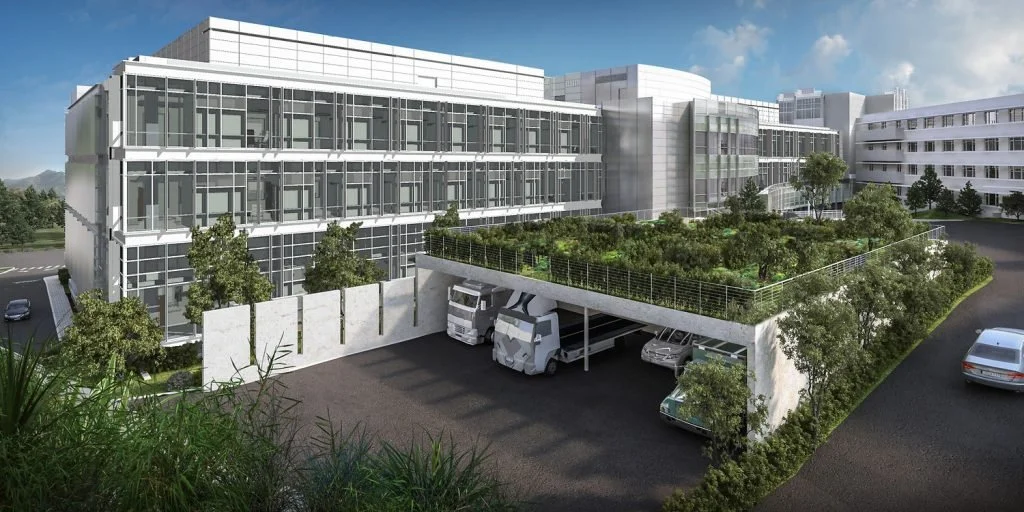 Architect rendering of Marin Health Oak Pavilion Hospital in Greenbrae, Ca. White hospital, with lots of trees and greenery surrounding.