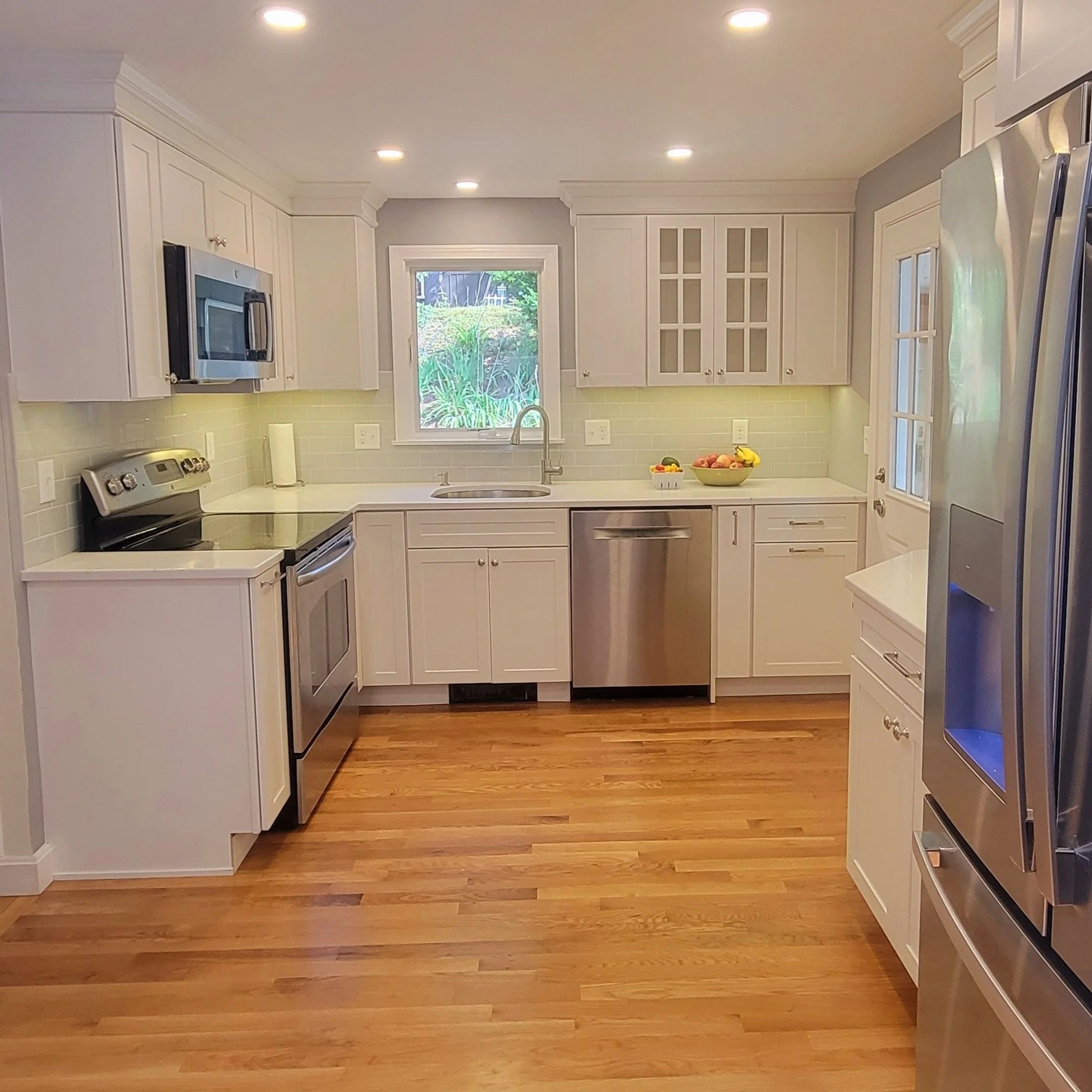 Residential Kitchen Remodel with updated layout, new cabinetry, countertops, and lighting