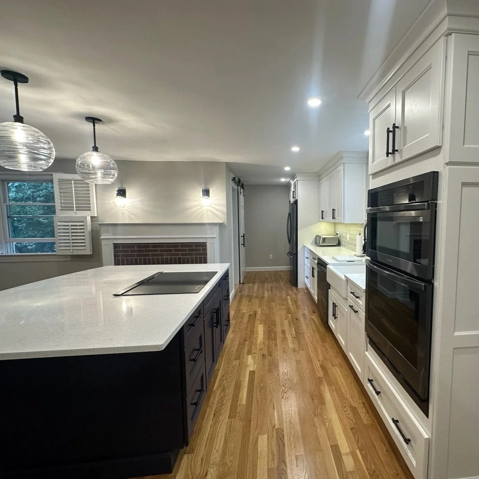 Residential Kitchen Remodel with updated layout, new cabinetry, countertops, and lighting