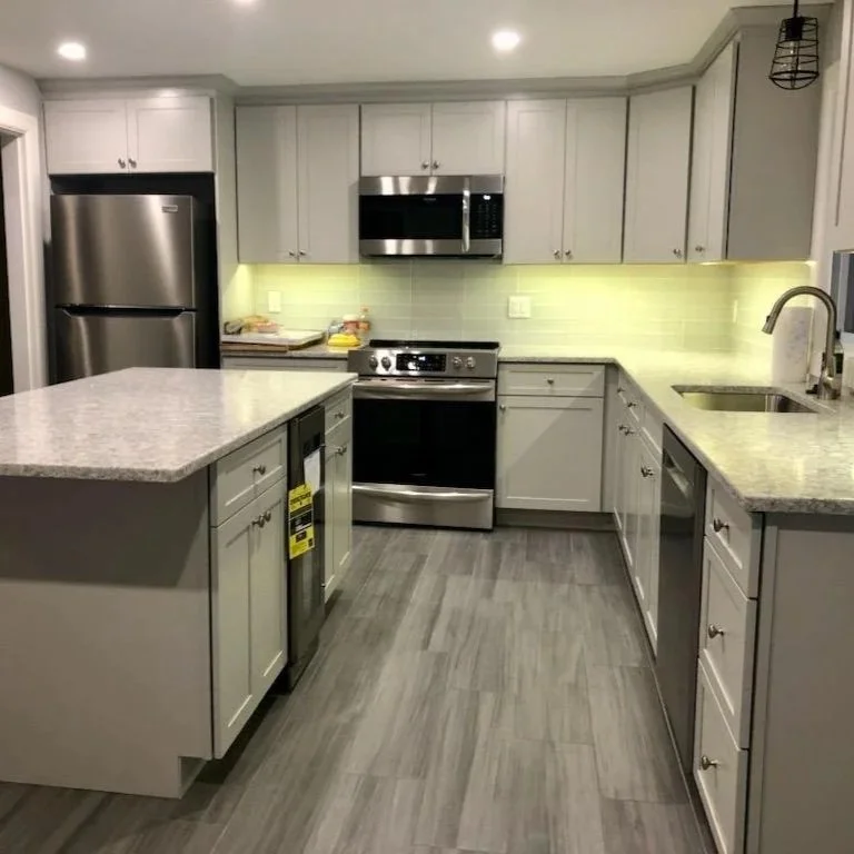 Residential Kitchen Remodel with updated layout, new cabinetry, countertops, and lighting
