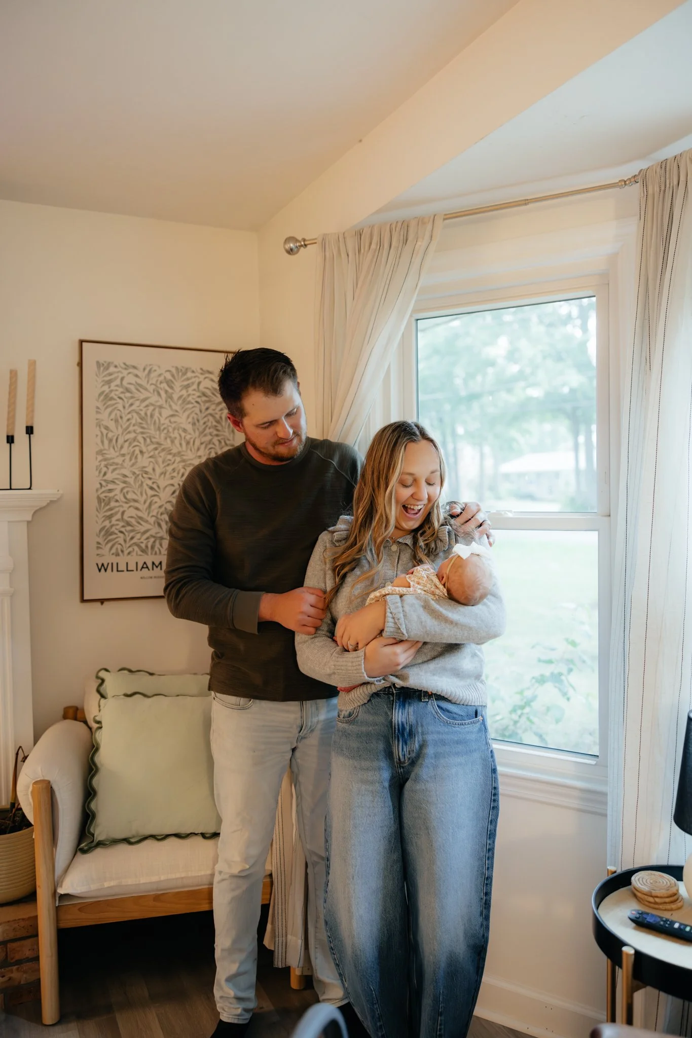 Cozy in home newborn and family photos, living room warm lighting, comforting emotions, after maternity motherhood.