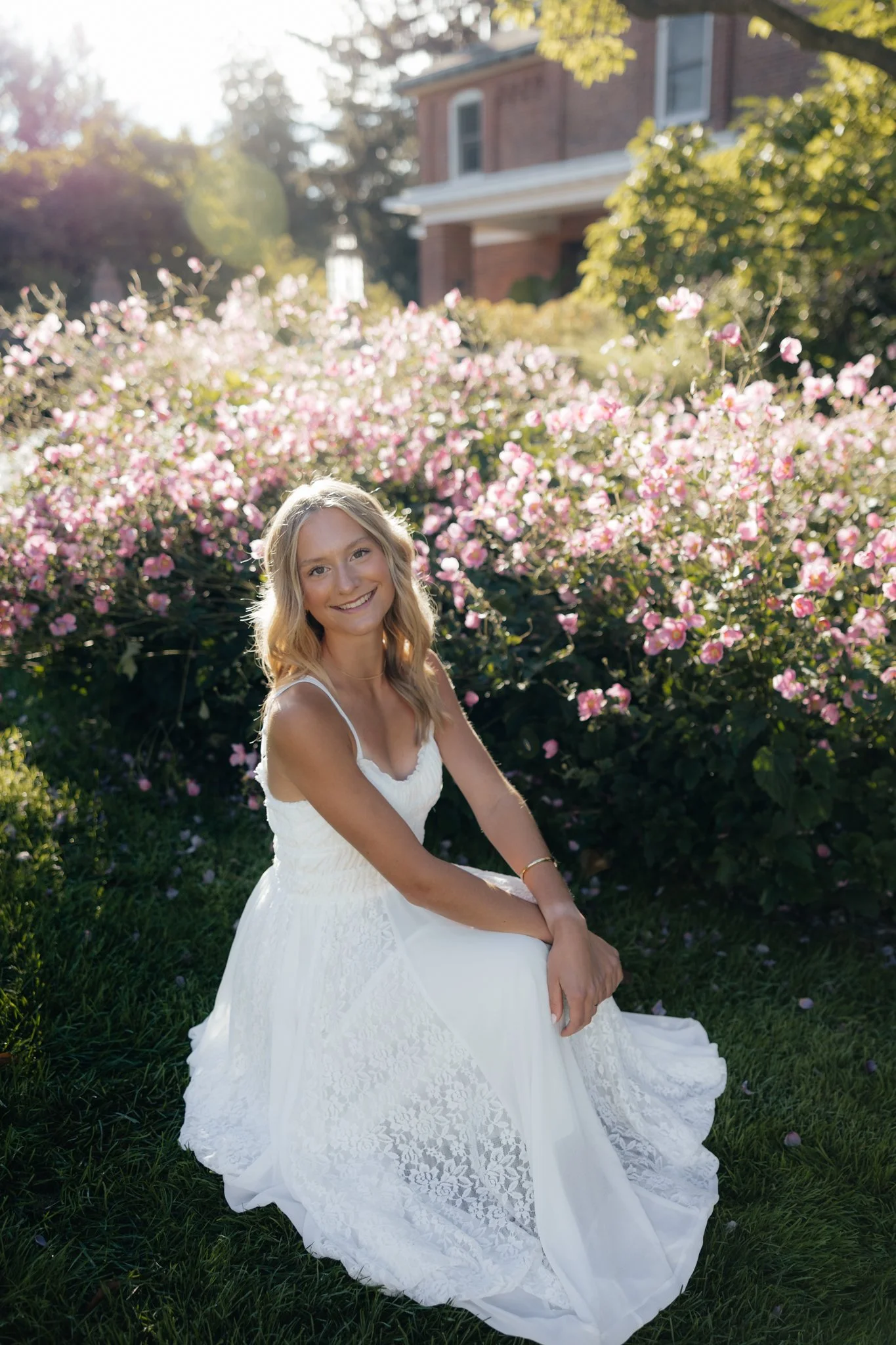Senior portraits for high school graduate on Michigan States campus in East Lansing, Michigan with flowers and good lighting.