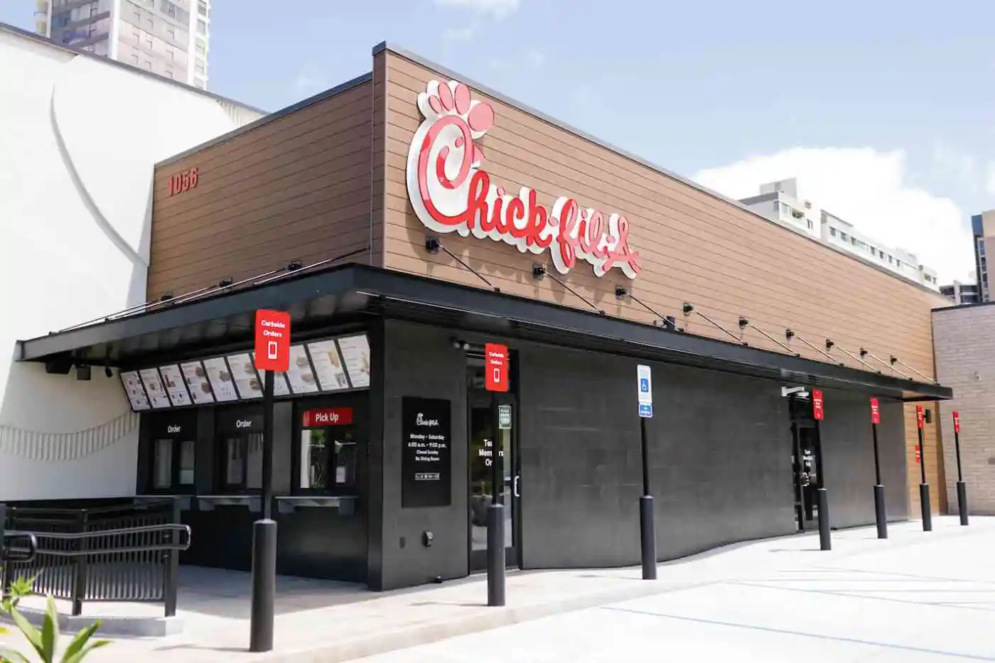 Exterior of Chick-fil-A Makiki, including a walk up window and some parking spots