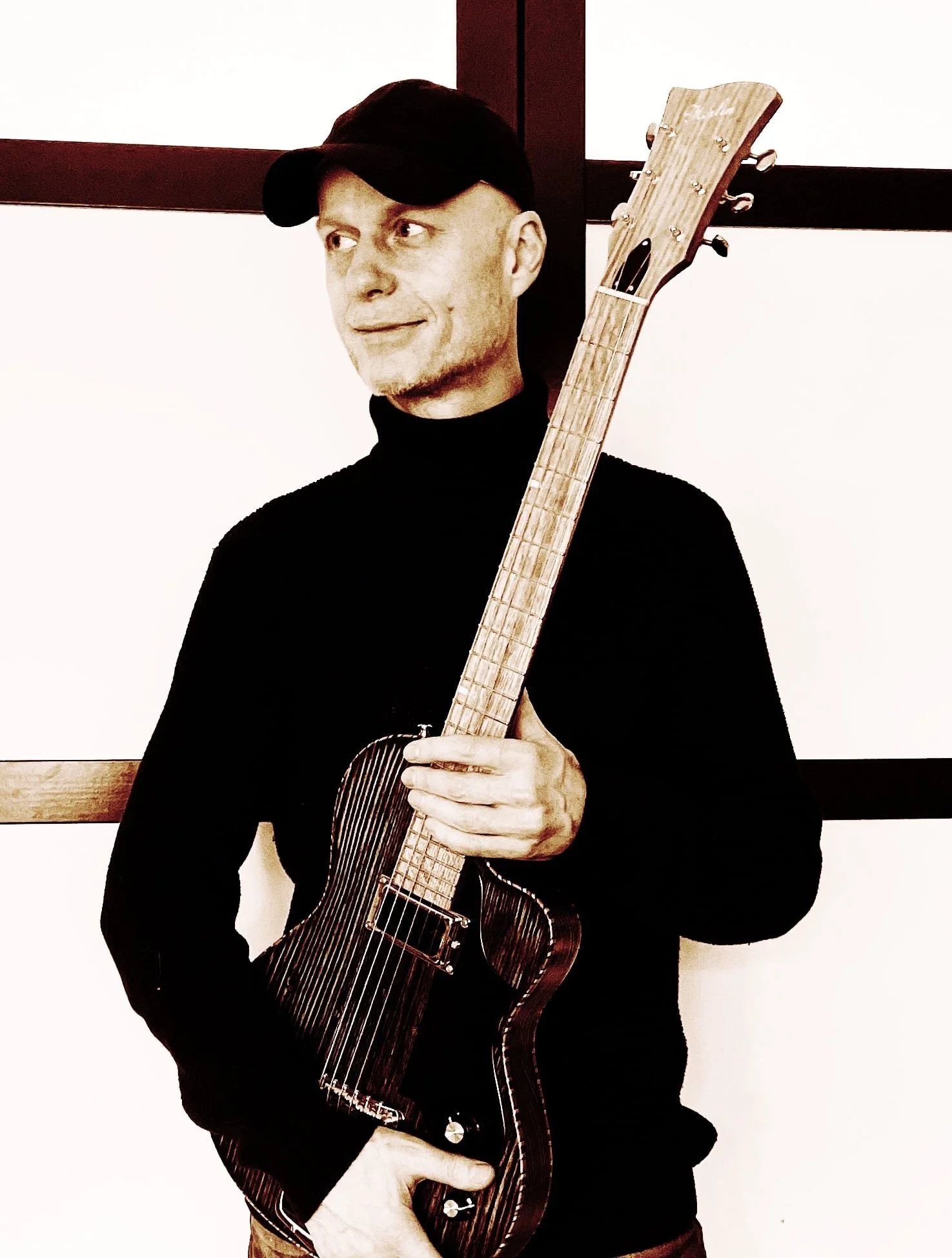 Martin Tallström with Nymph electric guitar by Jim Herlin, handcrafted in Stockholm with Scandinavian woods, acoustic roots, Hawaiian rope bindings,
electric guitar with an acoustic soul, Tallstrom