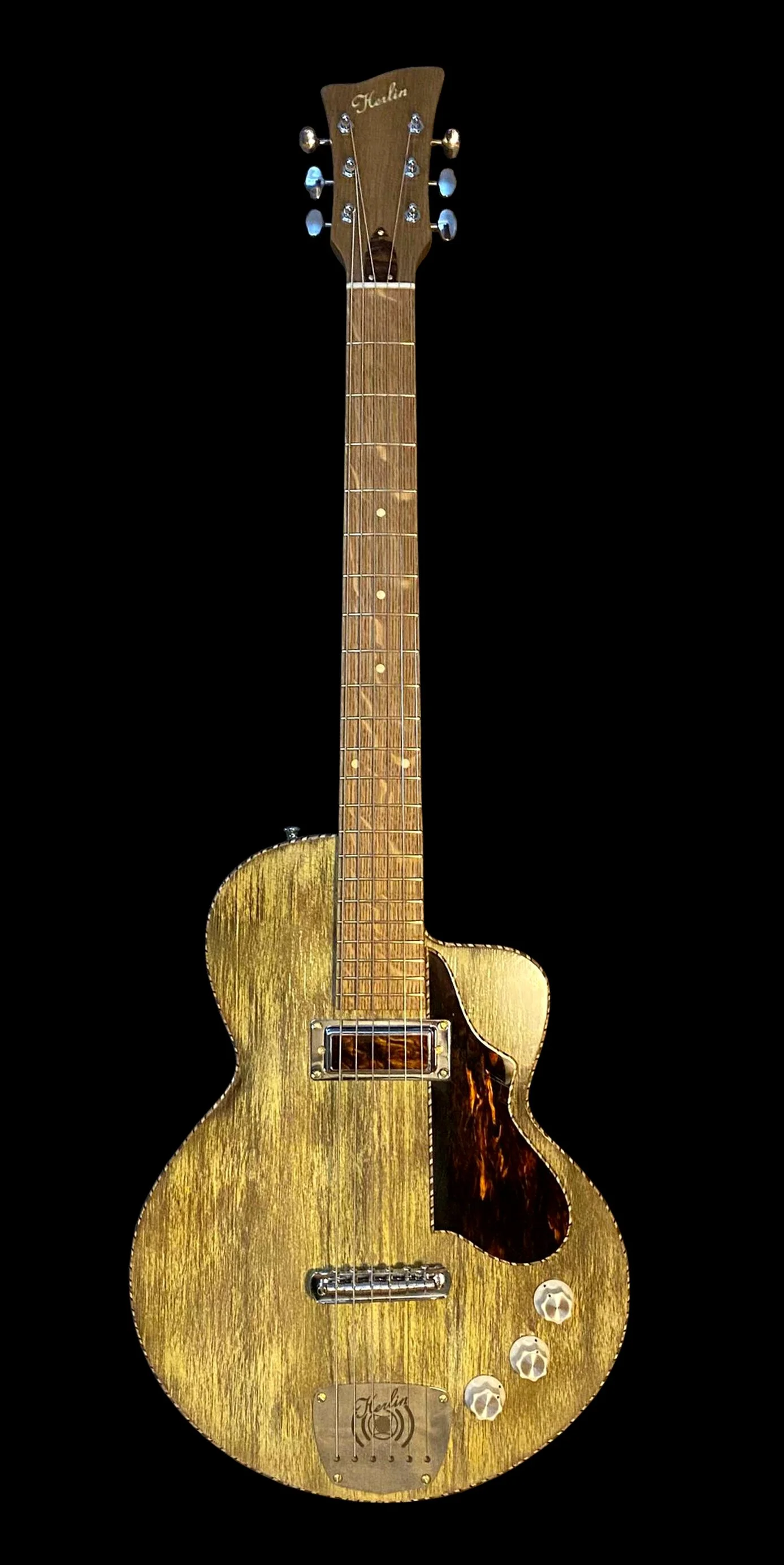 Nymph electric guitar by Jim Herlin, handcrafted in Stockholm with Scandinavian woods, acoustic roots, Hawaiian rope bindings,
electric guitar with an acoustic soul