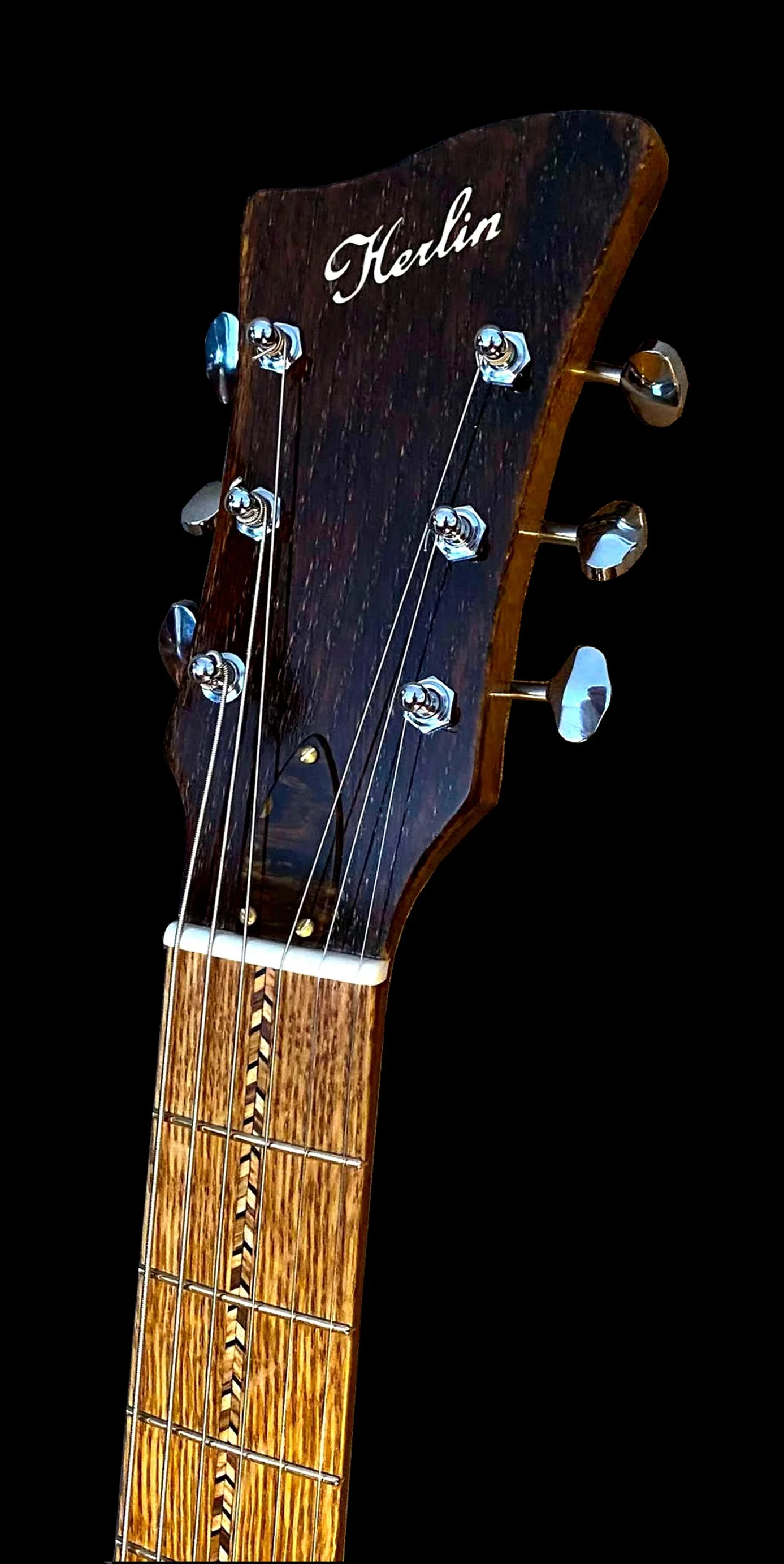 Handcrafted headstock by Jim Herlin, boutique guitar builder in Stockholm, Swedish design with acoustic roots