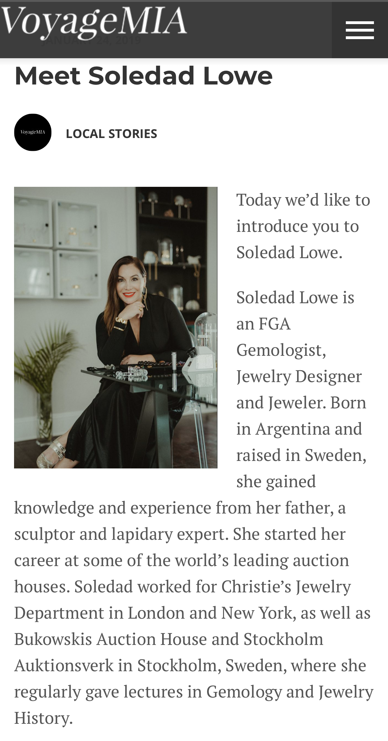 Webpage featuring an article about Soledad Lowe, a jewelry designer and gemologist, with a photo of her sitting at a desk, smiling, in a modern office setting with jewelry and decorative items on shelves behind her.