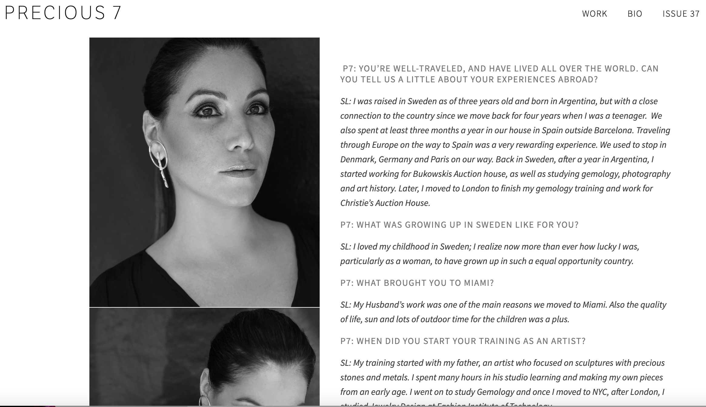 Black and white portrait of a woman with dark hair, wearing earrings, with slightly parted lips and a serious expression.