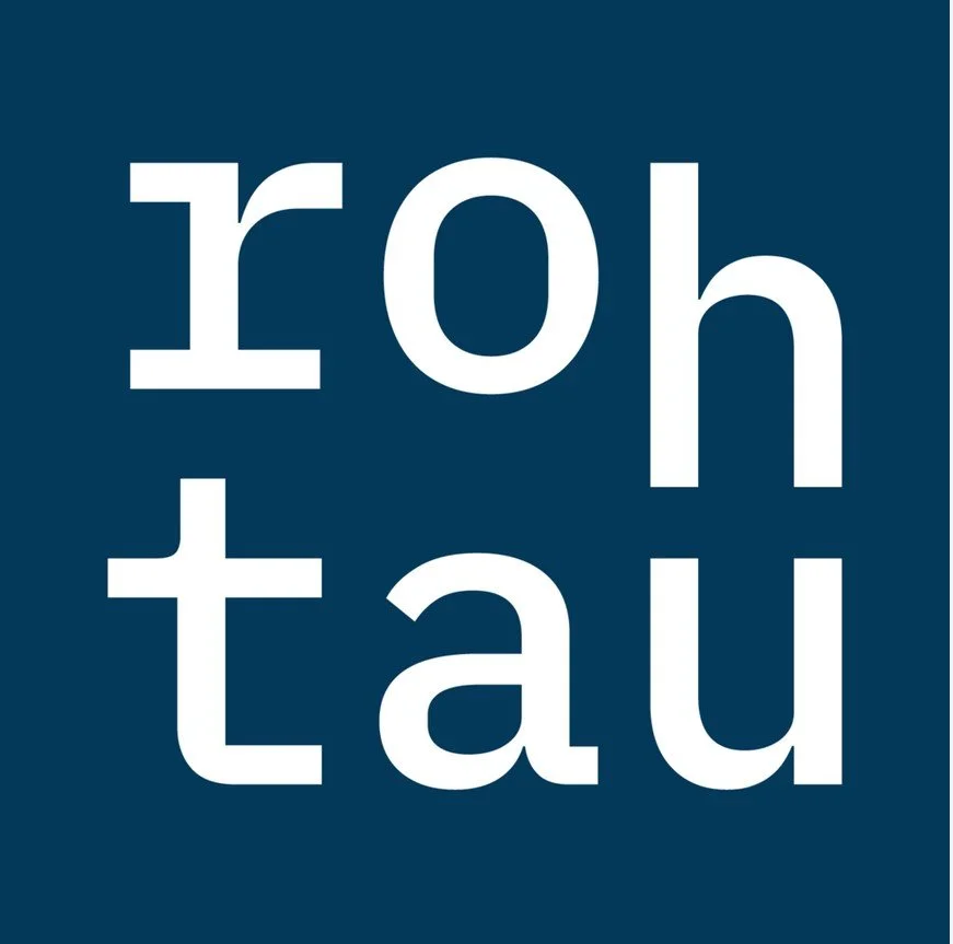 Close-up of white text 'rohtau' on a dark blue background, with some letters cut off at the edges.