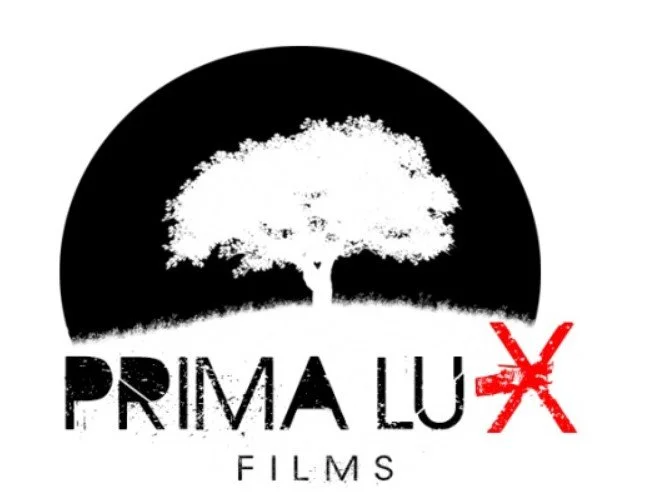 Logo featuring a tree inside a black circle with the text 'PRIMA LUX FILMS' beneath, with a red star-like mark over the letter 'X'.