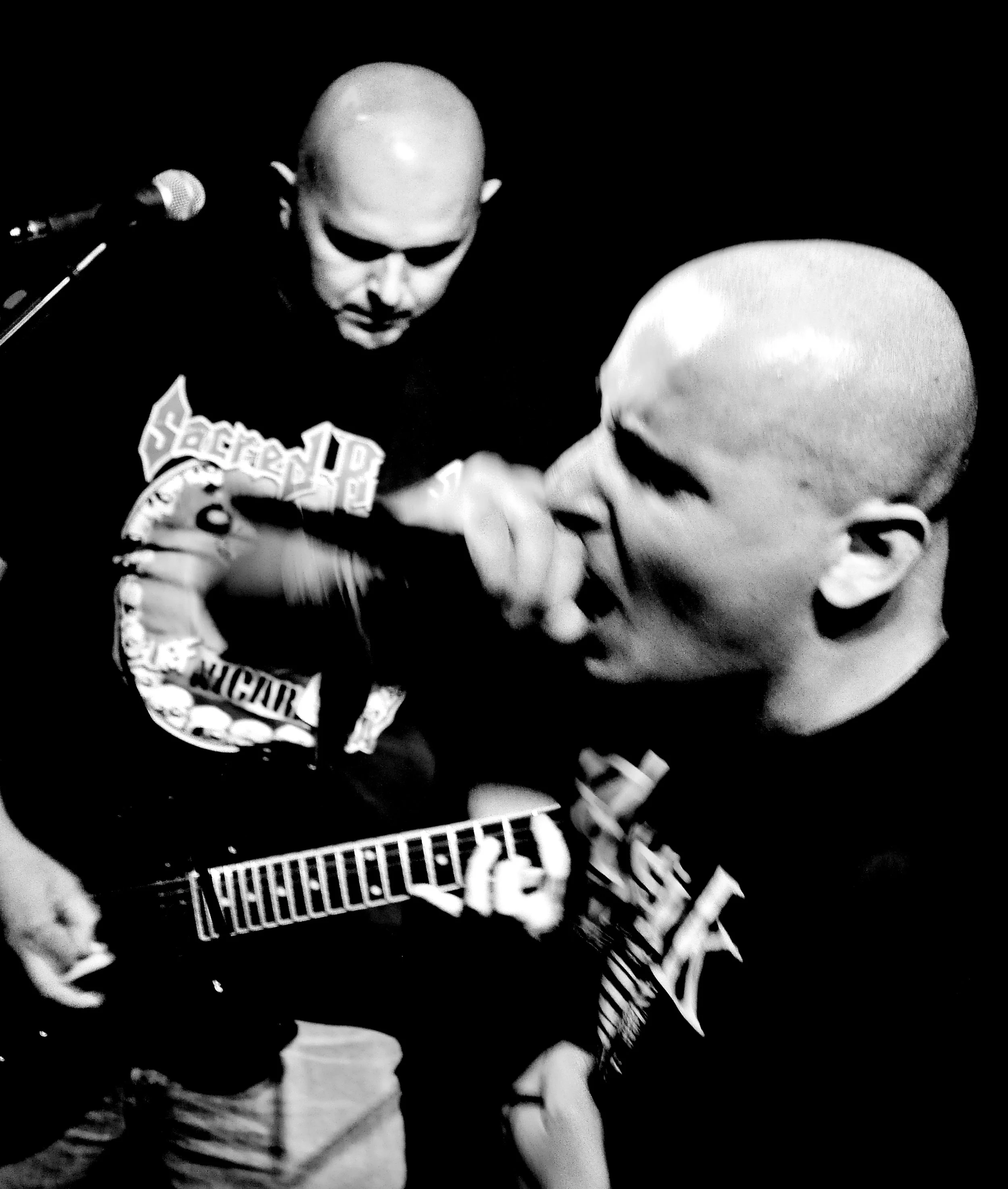 Black and white image of two young boys playing in band SUTNJA.