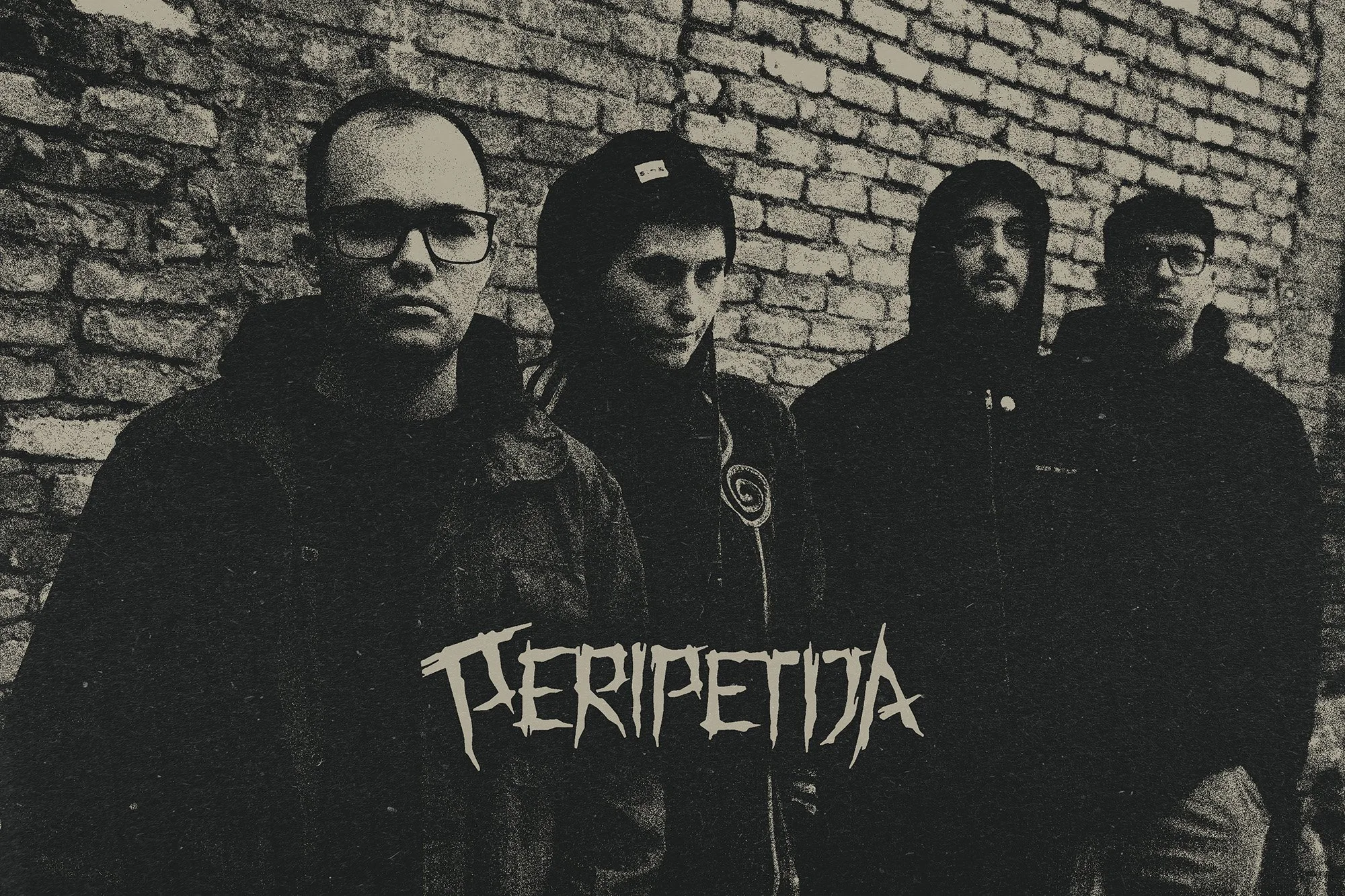 Four young people from band named PERIPETIJA standing against a brick wall, one with glasses, the second with a bandana, the third with long hair, and the fourth with glasses, all dressed in dark clothing.
